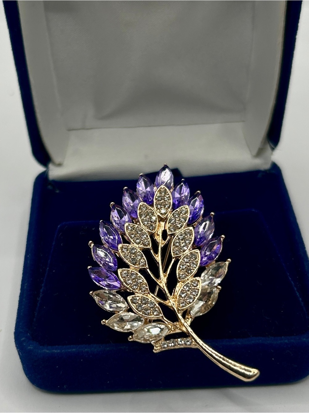 Gold Tone Leaf Brooch with Purple and Clear Faceted Glass Jewels​​